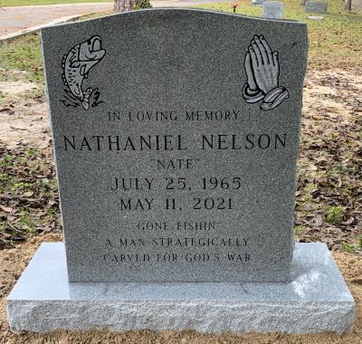 gray granite upright headstone with fish and praying hands emblems